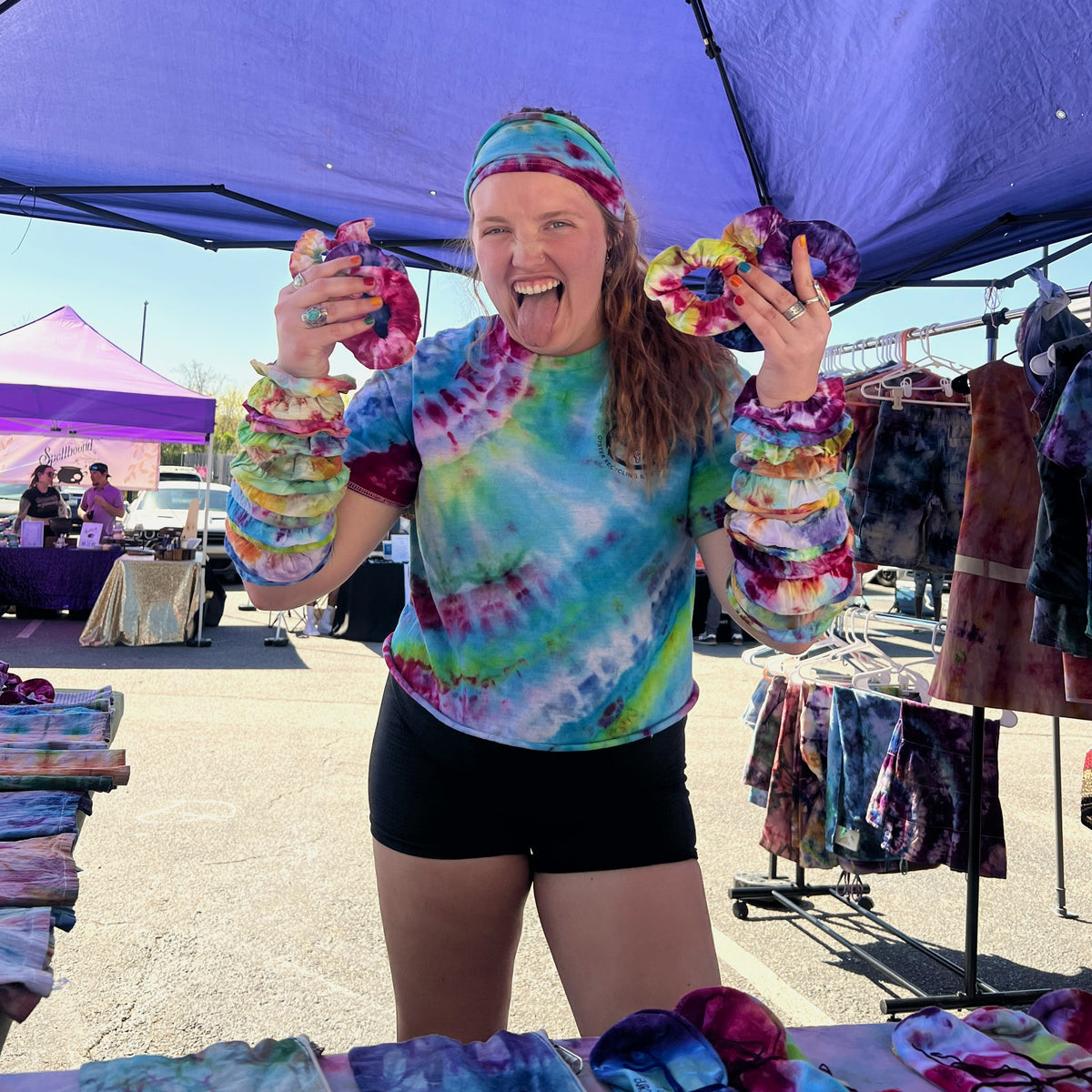 Person wearing tie dye clothing and scrunchies